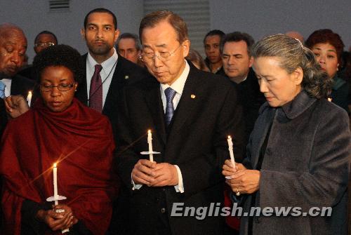 UN Secretary-General Ban Ki-moon (Front C) holds a candle during a vigil mourning Haitian earthquake victims at UN Headquarters in New York January 19, 2010. 