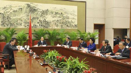 Chinese Premier Wen Jiabao (3rd L) presides over a plenary meeting of the State Council to discuss the draft of the government work report to be delivered at a national session of the country's parliament in Beijing, capital of China, January 19, 2010.