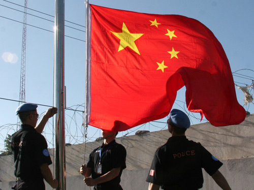 File photo shows members of Chinese formed police unit in Haiti held a flag-hoisting ceremony at their camp in Haiti.