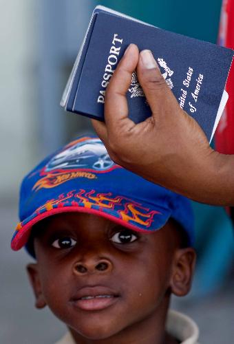 A kid gets ready to go aboard a plane to the United States in Port-au-Prince, Haiti, January 22, 2010.