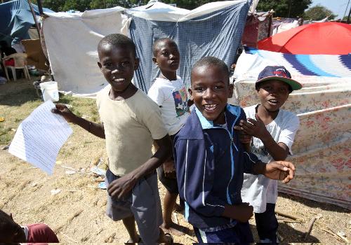 Kids play at a makeshift shelter in Port-au-Prince, Haiti, January 22, 2010. A 7.3 magnitude earthquake hit the country on January 12, 2010. 