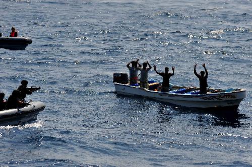 Chinese navy soldiers check a doubtable yacht in the Gulf of Aden, on January 22, 2010. The frigate is on an escort mission as part of a Chinese naval flotilla.