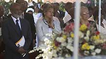 Haitian President Rene Preval takes part in the funeral service for Haitian Archbishop Joseph Serge Miot, who was killed in last week's devastating earthquake, outside Notre Dame d'Assumption Cathedral in Port-au-Prince January 23, 2010.