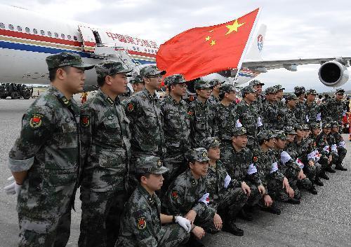 Members of the Chinese medical care and epidemic prevention team pose for a group photo at an airport in Port-au-Prince, capital of Haiti, on January 25, 2010. 