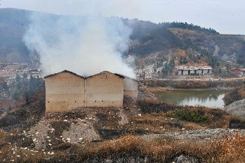 Smoke is seen at the Changjin Firecrackers Plant in Taolin Town of Linxiang City, central-south China's Hunan Province, January 26, 2010. 