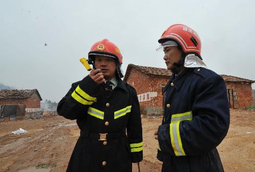 Firemen work at the site of explosion at the Changjin Firecrackers Plant in Taolin Town of Linxiang City, central-south China's Hunan Province, January 26, 2010. 