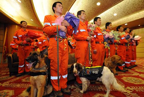 Members of China International Search and Rescue Team (CISAR) arrive at Capital International Airport in Beijing, capital of China, on January 27, 2010.