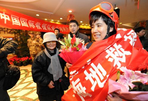 Cao Li, member of China International Search and Rescue Team (CISAR), arrives at Capital International Airport in Beijing, capital of China, on January 27, 2010. 