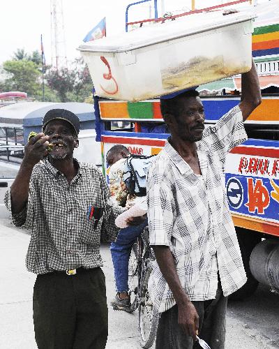 Venders sell food in the street in Port-au-Prince, capital of Haiti, January 26, 2010. 
