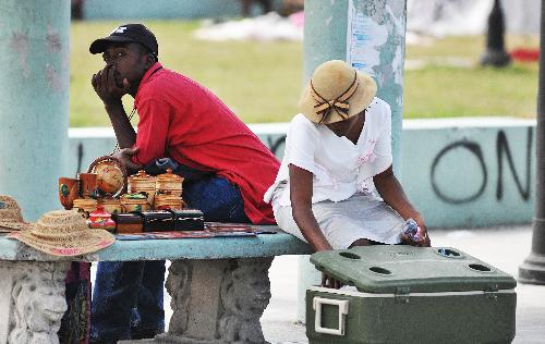 Venders sell handicrafts in the street in Port-au-Prince, capital of Haiti, January 26, 2010. 