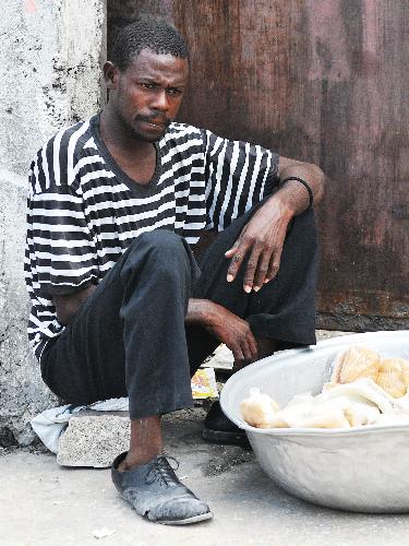 A vender sells food in the street in Port-au-Prince, capital of Haiti, January 26, 2010.