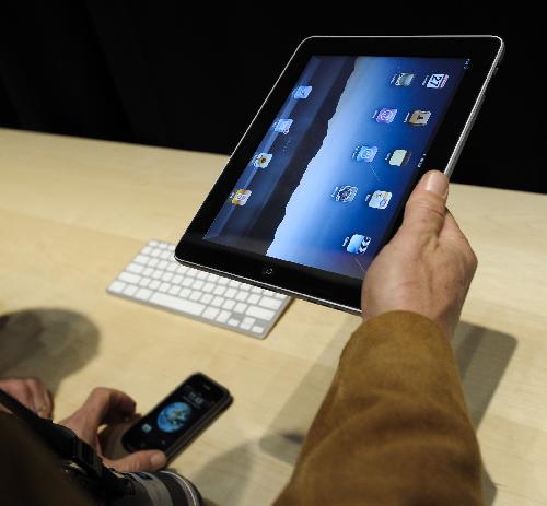 A man tries out Apple's new iPad after its launch event in San Francisco, California, the United States, January 27, 2010.