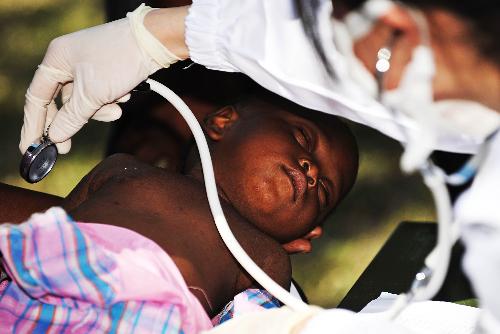A Haitian child receives medical treatment at a makeshift hospital set up by a Chinese medical team in Port-au-Prince January 27, 2010.