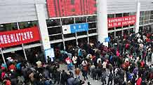 Passengers queue to buy tickets at the Fuzhou Railway Station in Fuzhou, capital of southeast China's Fujian Province, January 30, 2010. China's railways are expected to transport 210 million passengers during the 40-day travel peak starting from January 30, as people return home for family reunion in the traditional Spring Festival beginning from Feb. 14 this year and then go back to workplaces.