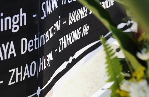 Photo taken on January 28, 2010 shows the name of Zhao Huayu, a Chinese peacekeeping police officer dead in the January 12 earthquake, during a memorial service held by the United Nations in Port-au-Prince, capital of Haiti. The UN confirmed on Thursday that 85 of it staff members lost their lives in the earthquake.