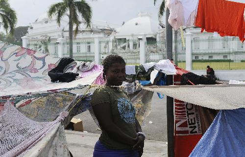 A girl is seen at a temporary settlement for quake victims outside the presidential palace in Port-au-Princes, capital of Haiti, January 31, 2010.