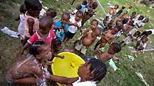 Orphans are taking their bath in Port-au-Princes, capital of Haiti, January 30, 2010. Before the deadly earthquake, there were nearly 100,000 orphans in Haiti.