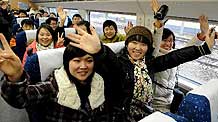 Passengers sit on the high-speed Electric Multiple Unit (EMU) train coded G2003 heading to Xi'an in Zhengzhou, central China's Henan Province, on February 6, 2010.