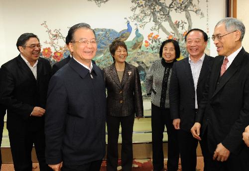 Chinese Preimer Wen Jiabao (2nd L) talks to representatives during a meeting on education in Beijing February 5, 2010. The Premier presided over five meetings from January 11 to February 6 to solicit opinions from representatives from all walks of life on a plan of education reform and development that the Chinese government is formulating