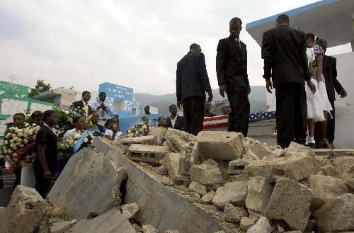 People attend the funeral of two American volunteers in Port-au-Prince, capital of Haiti, Feruary 6, 2010.