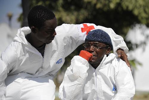 A volunteer assistant cries as he knows that the Chinese medical team is leaving, in Port-au-Prince, February 7, 2010.
