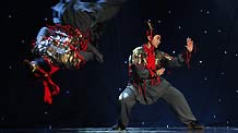 Actors from the Art Troupe of the High School Affiliated to Renmin University (RDFZ) of China perform Chinese Kongfu 'Emperor Qin's Soldiers' in Wellington College, Crowthorne of Berkshire, Britain, February 8, 2010.