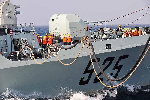 China's missile frigate 'Ma'anshan' receives supplies from Chinese 'Qiandaohu' supply ship in the Gulf of Aden, Feb. 11, 2010. 