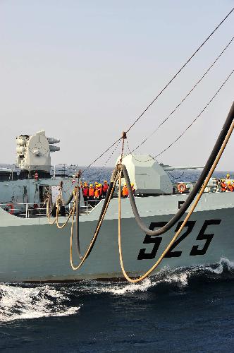 China's missile frigate 'Ma'anshan' receives supplies from Chinese 'Qiandaohu' supply ship in the Gulf of Aden, Feb. 11, 2010.