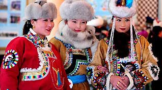 Participants pose during a show of Mongolian winter dresses in Dong Ujimqin Banner, Xilin Gol League, north China's Inner Mongolia Autonomous Region, on Feb. 16, 2010. Twenty teams from various parts of Inner Mongolia took part in the show on Tuesday.