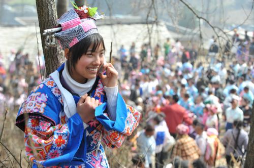 A girl of Miao ethic group is seen on the annual traditional Tiaohua Festival at Jiupanjing village in Huaxi District in Guiyang, capital of southwest China's Guizhou Province, Feb. 22, 2010. 