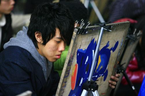 A student performs as a part of the entrance examination for act academies in Shandong University of Art and Design in Jinan Shungeng International Convention and Exhibition Center in Jinan, capital of east China's Shandong Province, Feb. 24, 2010.