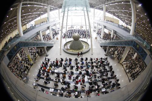 Students take part in the entrance examination for art academies in Shandong University of Art and Design in Jinan Shungeng International Convention and Exhibition Center in Jinan, capital of east China's Shandong Province, Feb. 24, 2010. 