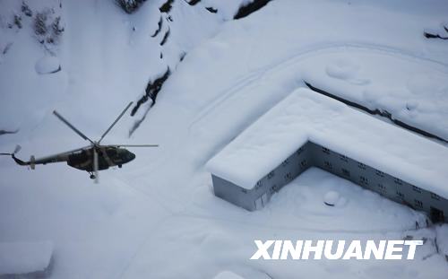 Helicopters are dispatched to rescue people trapped by avalanches in Xinjiang on Thursday, February 25, 2010. 