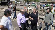 Chilean President Michelle Bachelet (front 2nd R) talks with people at the quake-hit area in Concepcion, Chile, Feb. 27, 2010.