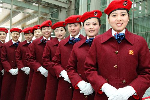 Attendants from Beijing Conference Center welcomes members of the 11th National Committee of the Chinese People's Political Consultative Conference (CPPCC) at the airport in Beijing, China, March 1, 2010.