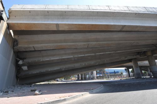 A collapsed bridge is seen in the northern suburb of Santiago, capital of Chile, March 1, 2010. 