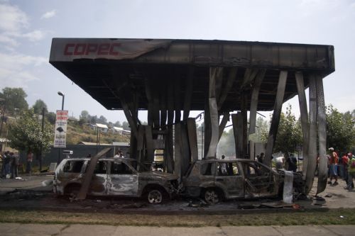A destroyed gas station is seen after tsunami and the 8.8-magnitude earthquake in Lota Port, 60km south Concepcion, Chile, March 2, 2010.