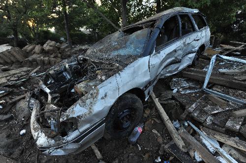 This photo taken on March 2, 2010 shows a wrecked car in Constitucion, 450 kilometers south of Santiago, capital of Chile.
