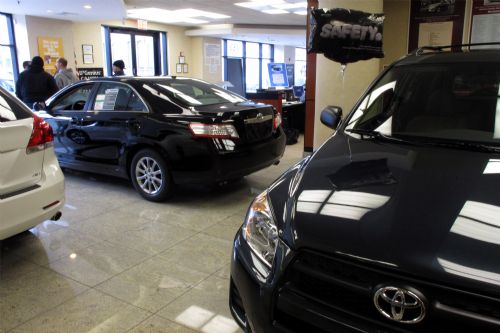 RAV 4 and Camry are seen at a Toyota showroom in New York, March 2, 2010. It was announced on Monday that Toyota has informed more than 1 million American and Japanese customers of a fault that leads to an oil leak in Toyota vehicles.