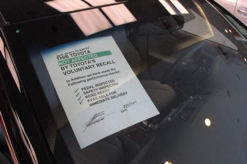 A notice reading 'not affected by Toyota's voluntary recall' is seen on a Toyota car at a Toyota showroom in New York, March 2, 2010. It was announced on Monday that Toyota has informed more than 1 million American and Japanese customers of a fault that leads to an oil leak in Toyota vehicles.