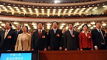 Members of the 11th National Committee of the Chinese People's Political Consultative Conference (CPPCC) sing the national anthem during the opening meeting of the Third Session of the 11th CPPCC National Committee at the Great Hall of the People in Beijing, capital of China, March 3, 2010.