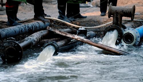 Water is drained from a flooded pit of the Luotuoshan Coal Mine in Wuhai City, north China's Inner Mongolia Autonomous Region, March 3, 2010.