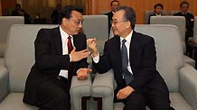 Chinese Premier Wen Jiabao (R) talks with Chinese Vice Premier Li Keqiang before the opening meeting of the Third Session of the 11th National Committee of the Chinese People's Political Consultative Conference (CPPCC) at the Great Hall of the People in Beijing, capital of China, March 3, 2010.