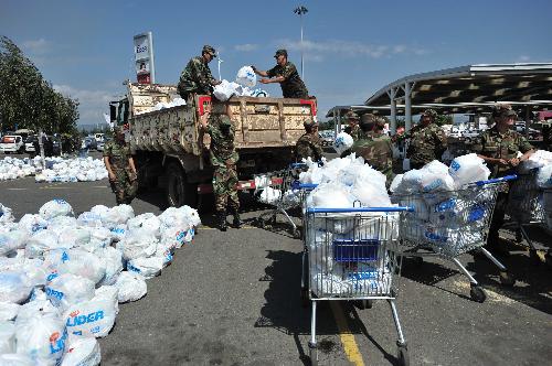 Soldiers prepare to deliver rescue materials to local residents in the quake-devastated Talcahuano, south Chile, March 3, 2010.