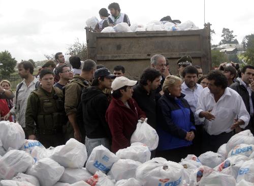 Chilean President Michelle Bachelet visits the humanitarian help center in the quake-devastated Concepcion, Chile, March 4, 2010. 