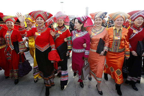 The NPC deputies from China's ethnic groups arrive at Tiananmen Square in Beijing, March 5, 2010.