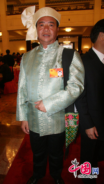 An NPC deputy from the Dai people, one of China&apos;s 56 ethnic groups, attends the National People&apos;s Congress at the Great Hall of the People in Beijing, March 5, 2010. 