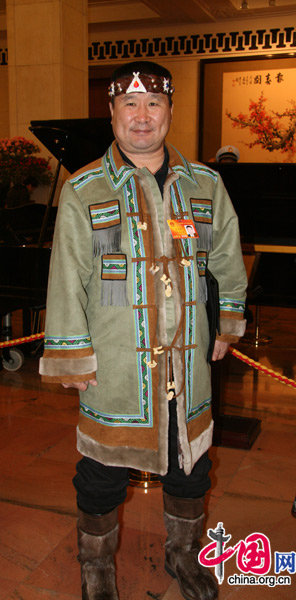 An NPC deputy from the Evenki people, one of China's 56 ethnic groups, attends the National People's Congress at the Great Hall of the People in Beijing, March 5, 2010. 