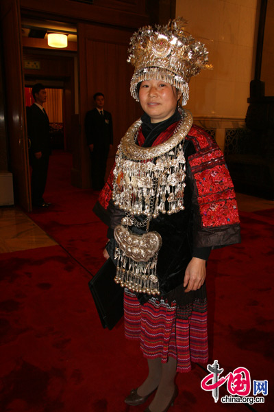 An NPC deputy from the Miao people, one of China's 56 ethnic groups, attends the National People's Congress (NPC) at the Great Hall of the People in Beijing, March 5, 2010. 