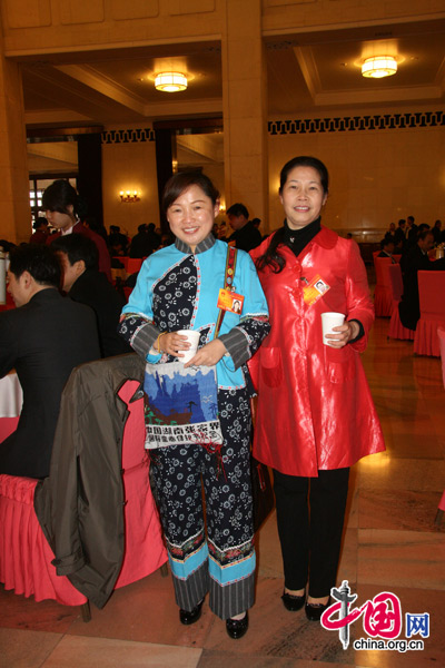 Two NPC deputies from the Tujia people, one of China's 56 ethnic groups, attend the National People's Congress at the Great Hall of the People in Beijing, March 5, 2010. 